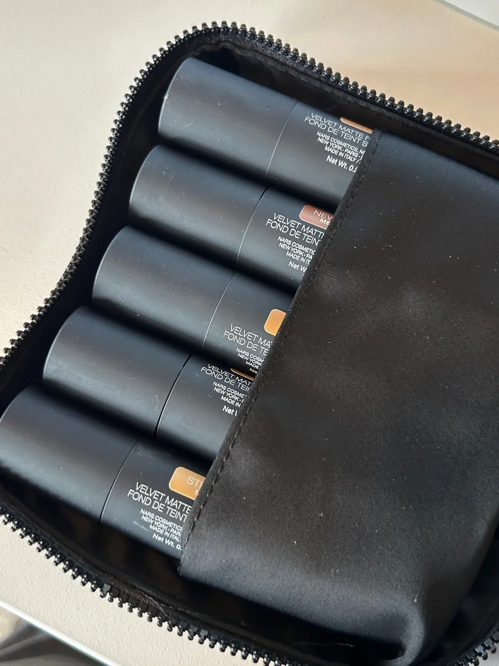 NARS 10 shade Velvet Matte Foundation Stick Set in Black Nylon Zip Cosmetic Bag.
